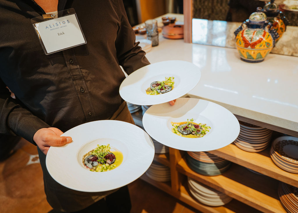 Chefs plating dishes in the Alisios kitchen