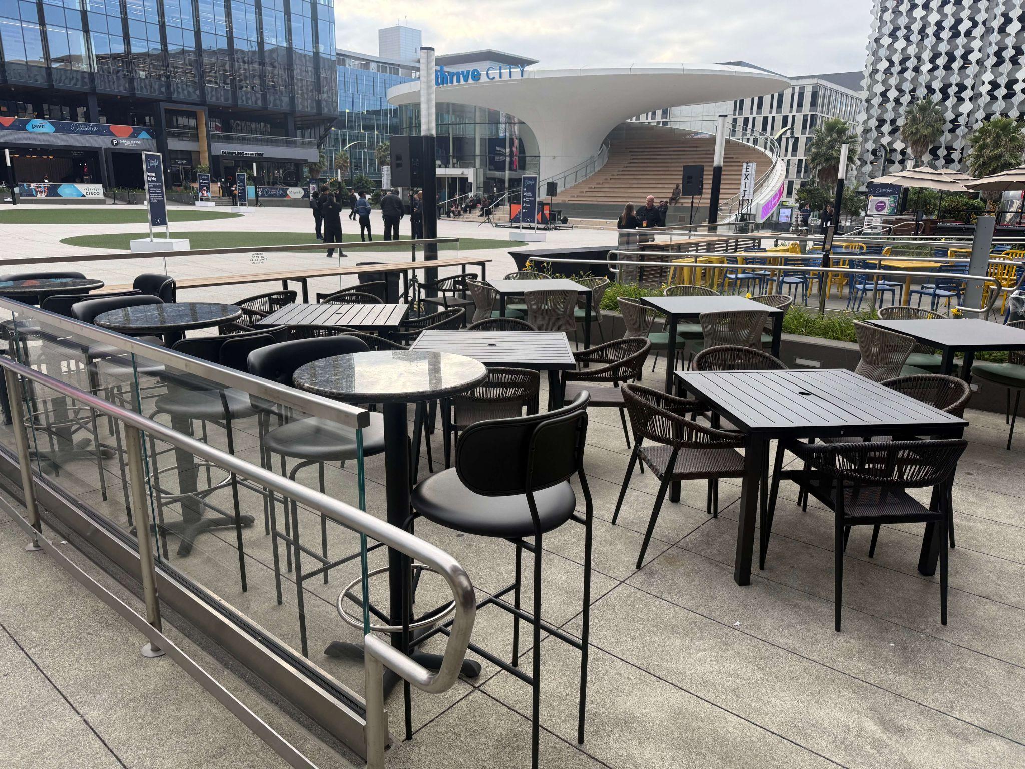 Burma Love Chase Center — both outdoor patios set for a full venue buyout with Thrive City in the background