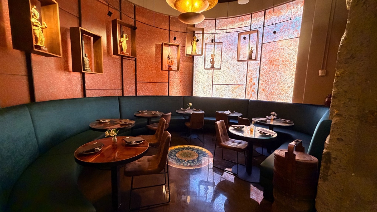 Ruby Room — jewel-toned semi-private dining beside the bar