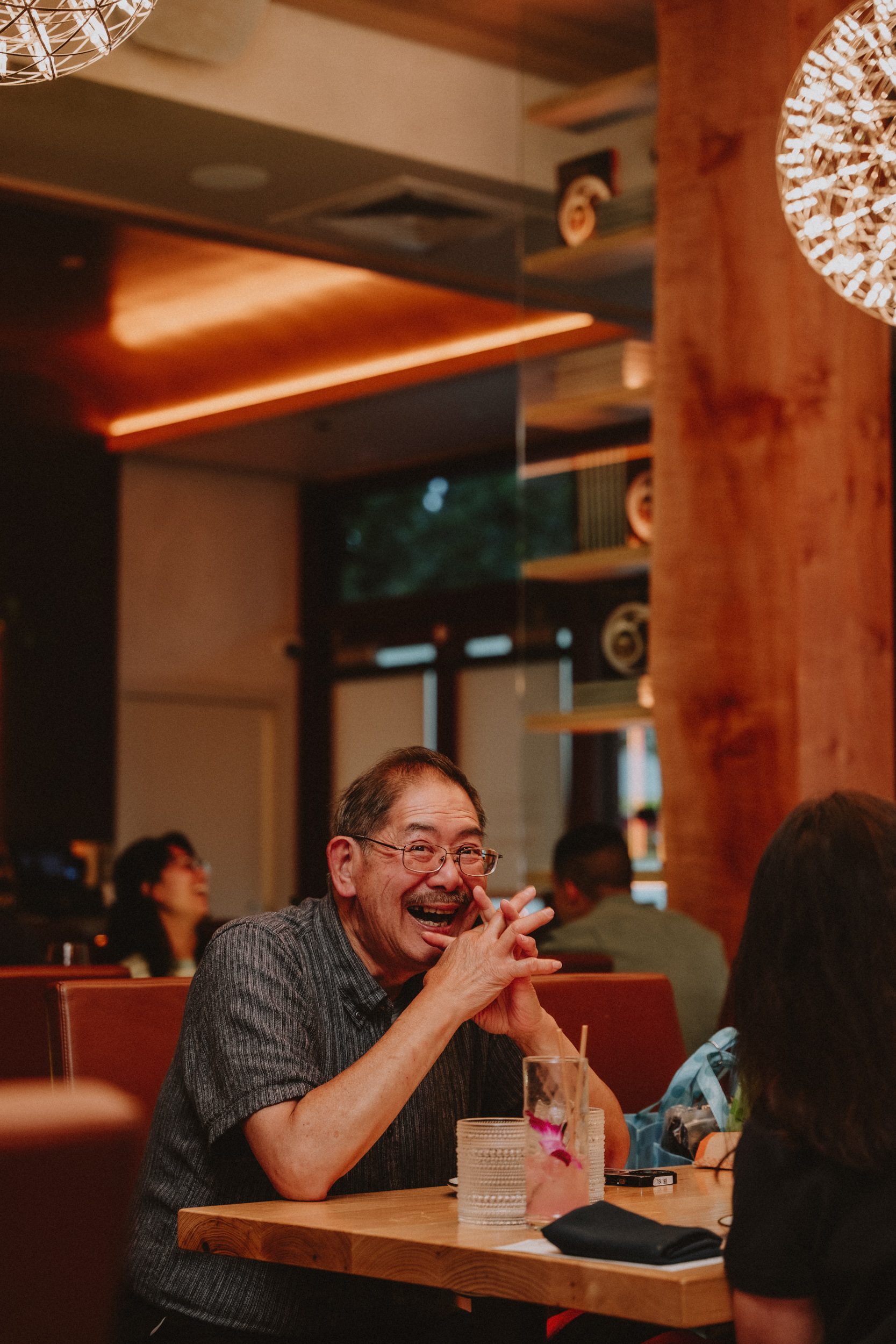 A regular laughing at the table