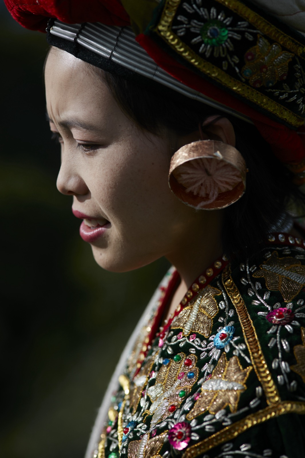 A woman in traditional Shan dress and headdress